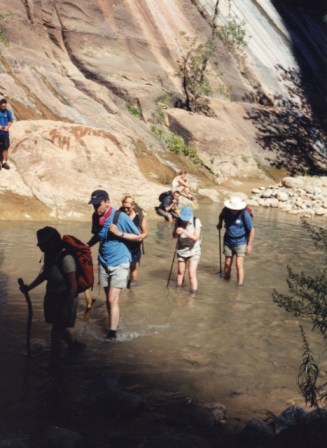 Zion wading up the Virgin River (467x640)